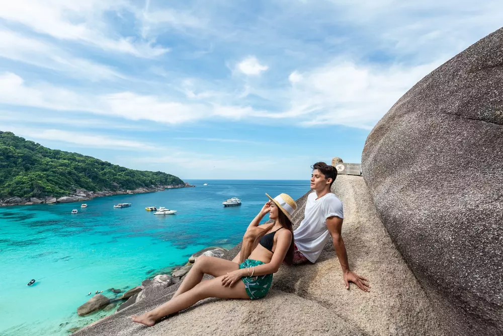 Sailing rock view point with a couple on the Similan Island