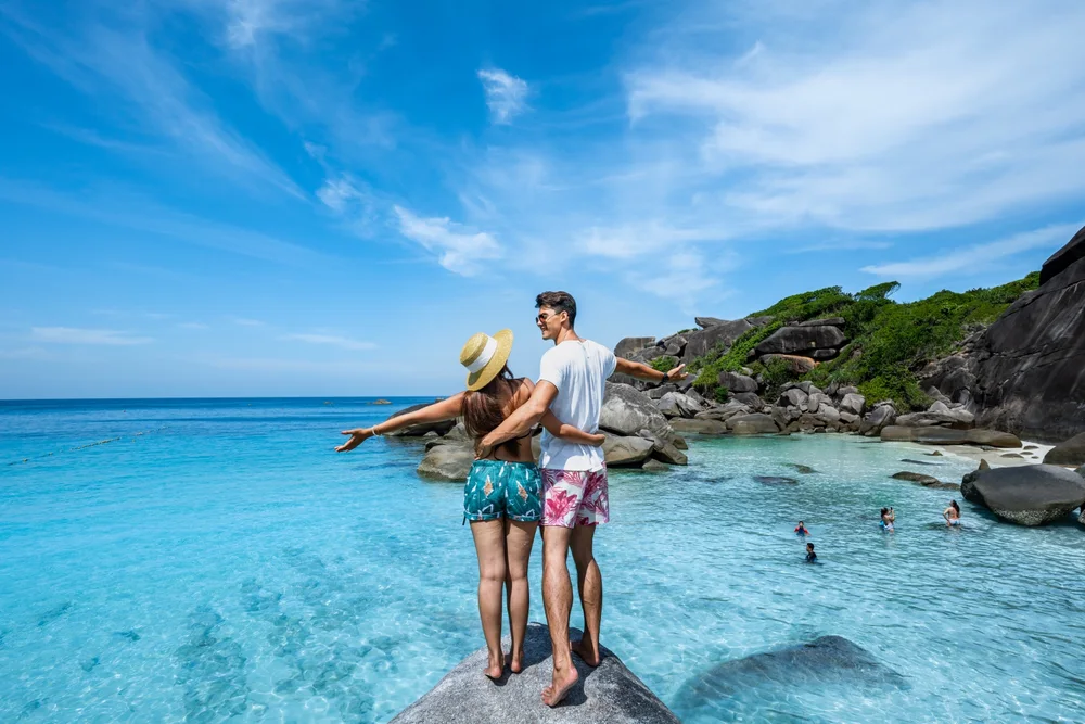 Couple on the rock with stunning view point