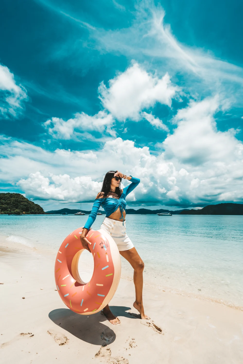 Guest enjoying Coral Island beach with a float during Smile Rainbow tour