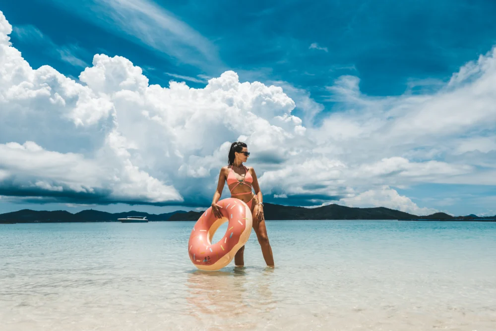 Coral Island clear water beach photo spot on Smile Rainbow Catamaran tour