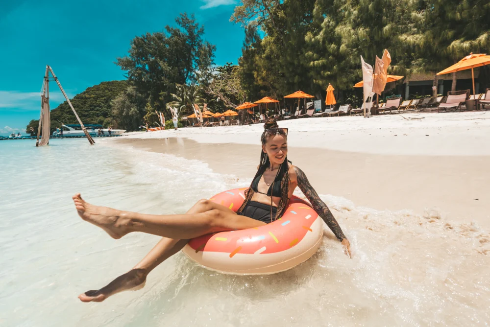 Relaxing on Coral Island beach during Smile Rainbow Phuket tour