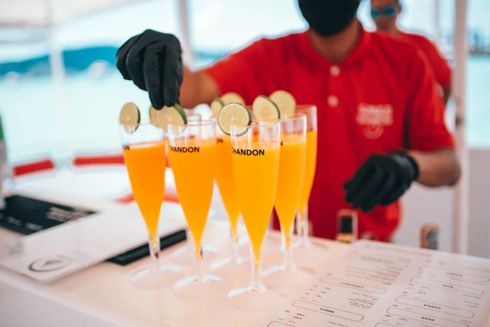 Welcome drinks served on Smile Rainbow Catamaran Phuket tour