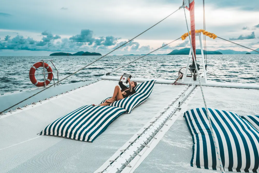 Front trampoline net area of Smile Rainbow Catamaran with ocean view