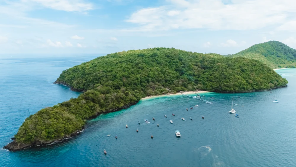 Coral Island Banana Beach aerial view with boat landing