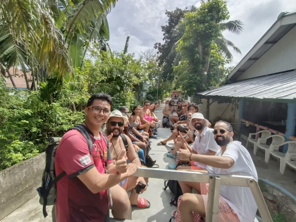 Tour guide accompanying travelers during an island transfer at Racha Island