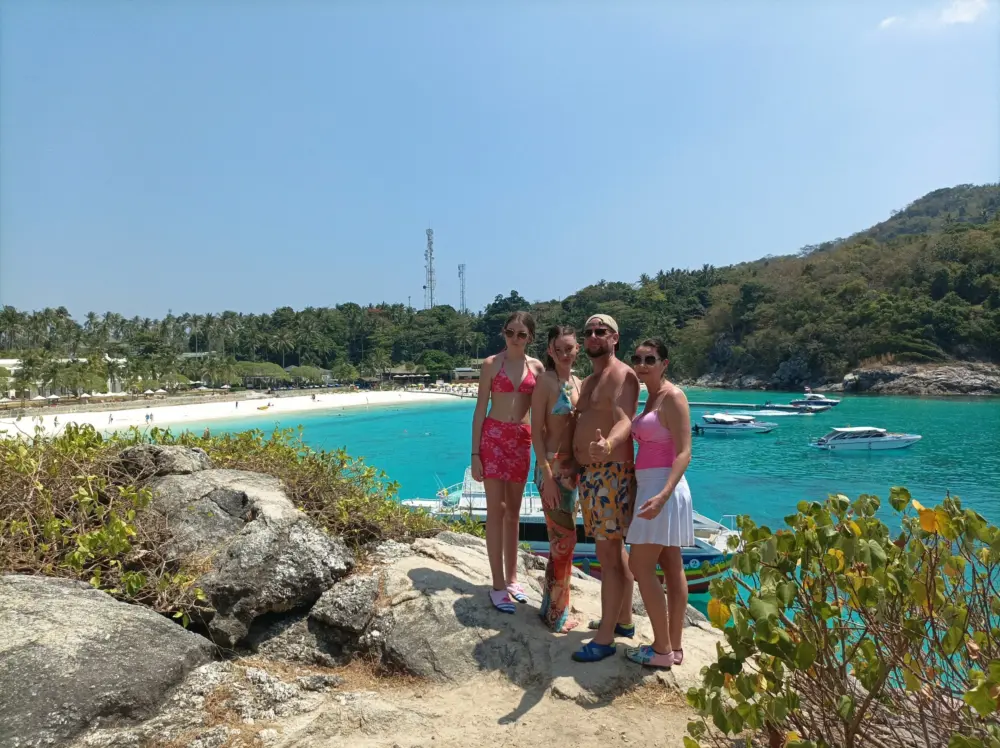 Family taking a photo at Patok Bay viewpoint on Racha Island Phuket