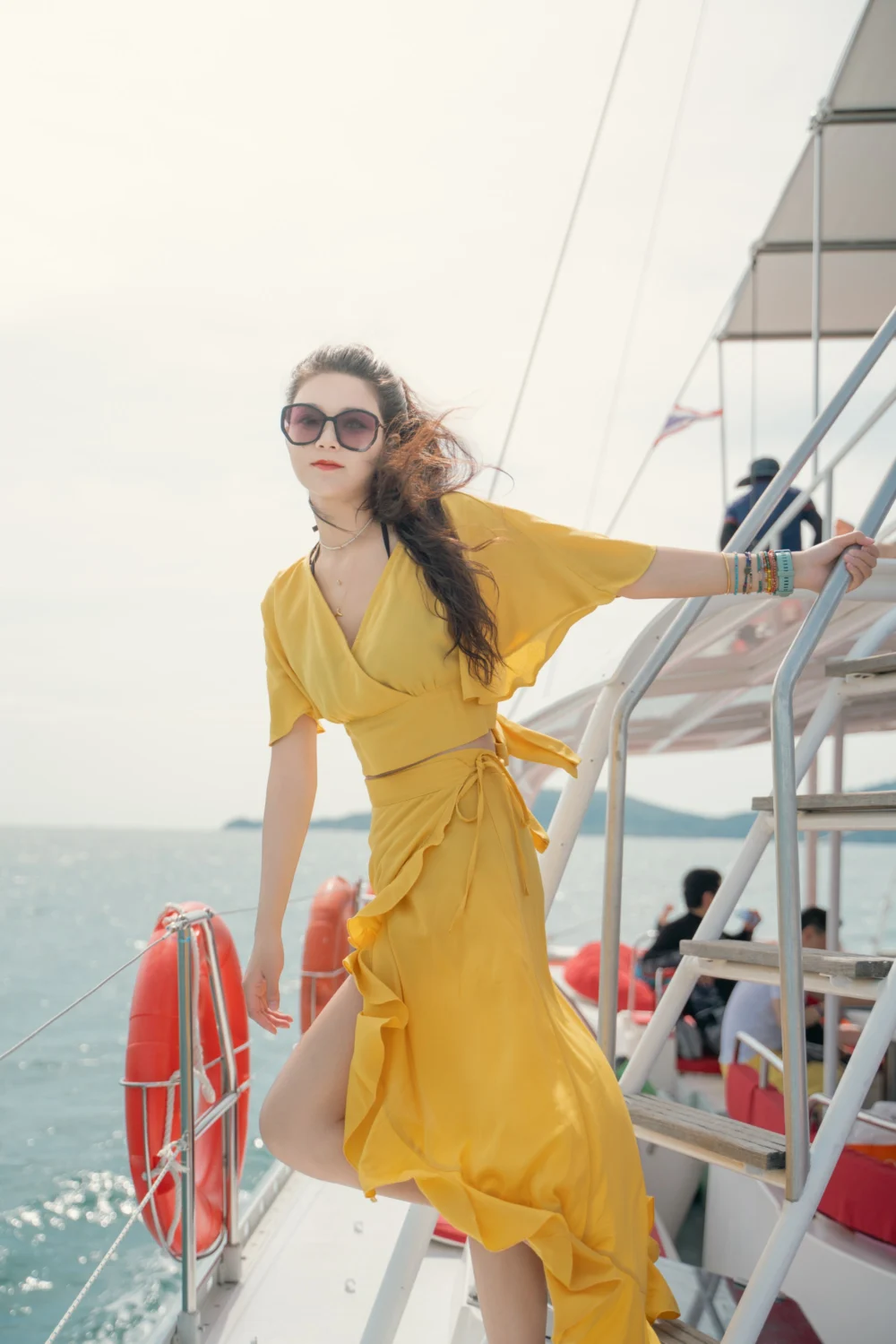 Guest standing on the stairs aboard Marvel Catamaran