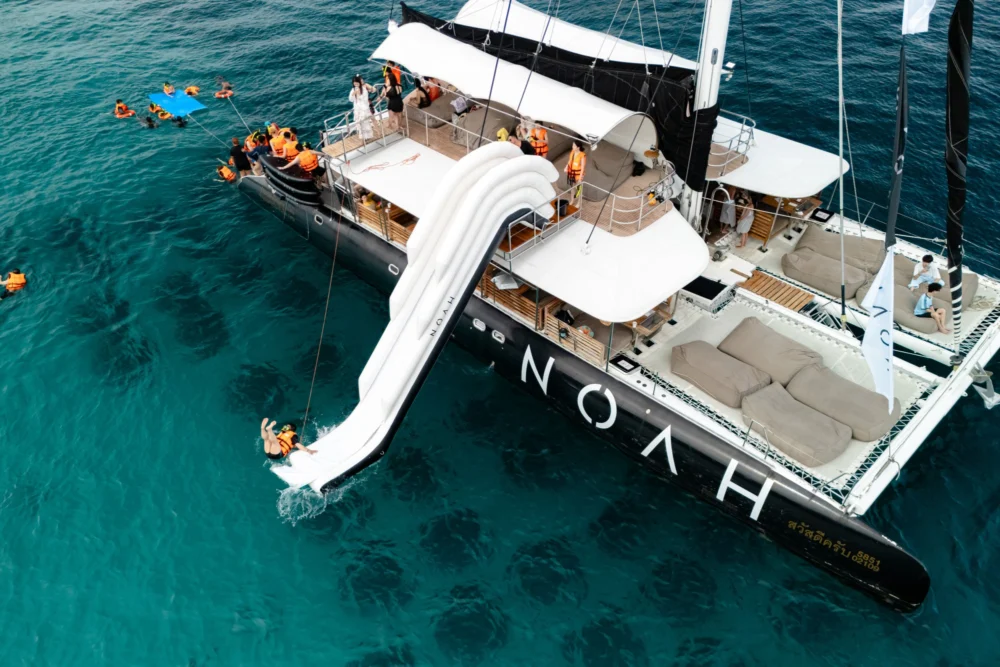 Aerial view of guests using the Noah Catamaran water slide