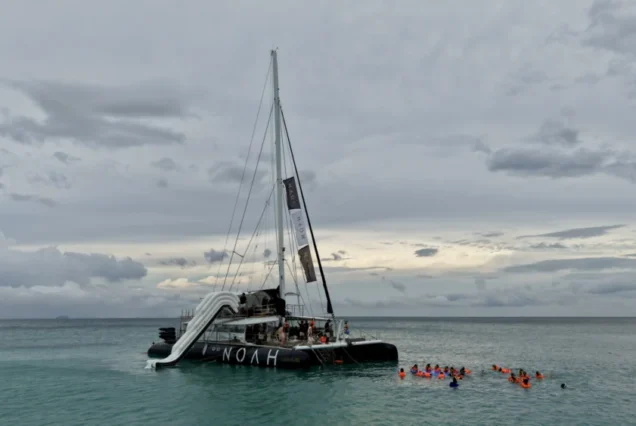Aerial view of Noah Catamaran near a tropical island