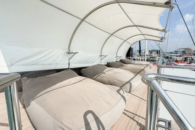 Covered upper-deck sofa lounge on Noah Catamaran