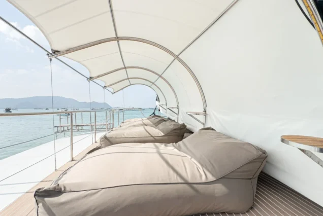 Covered upper-deck sofa and sea view on Noah Catamaran