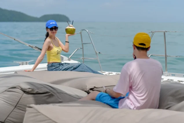 Guest travel photography with a coconut aboard Noah Catamaran