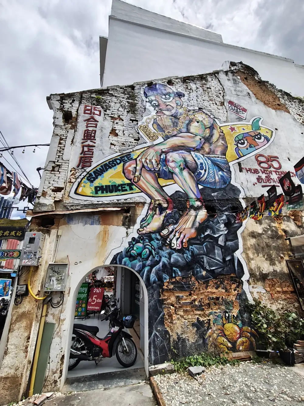 Wall murals on Thalang Road in Phuket Old Town for family photo stops