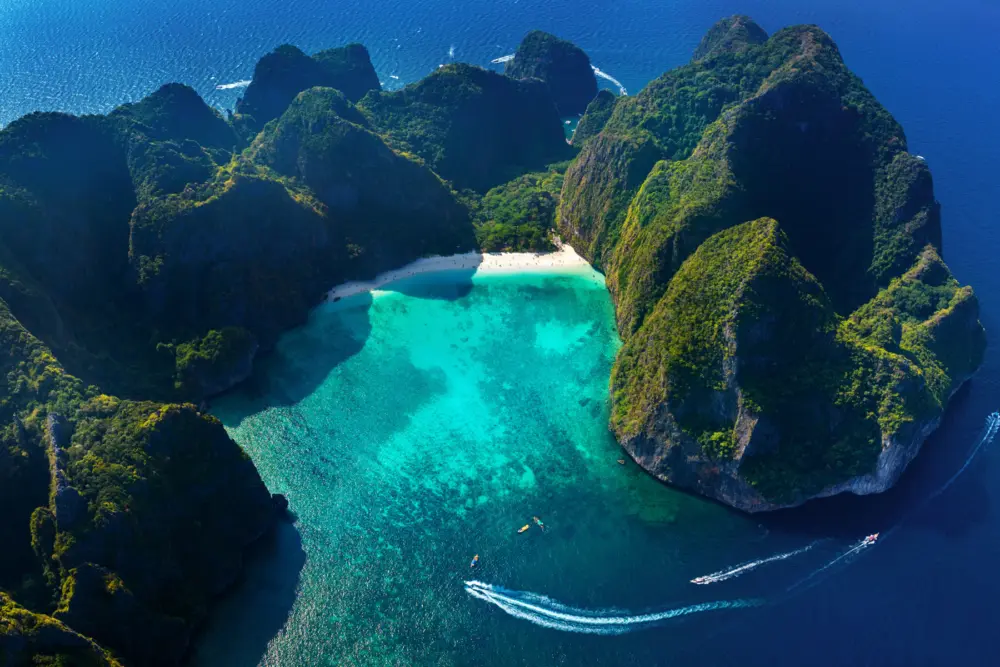Maya Bay at Phi Phi Island with limestone cliffs and calm turquoise water