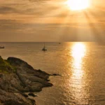 Promthep Cape sunset view in Phuket during calm evening sea conditions