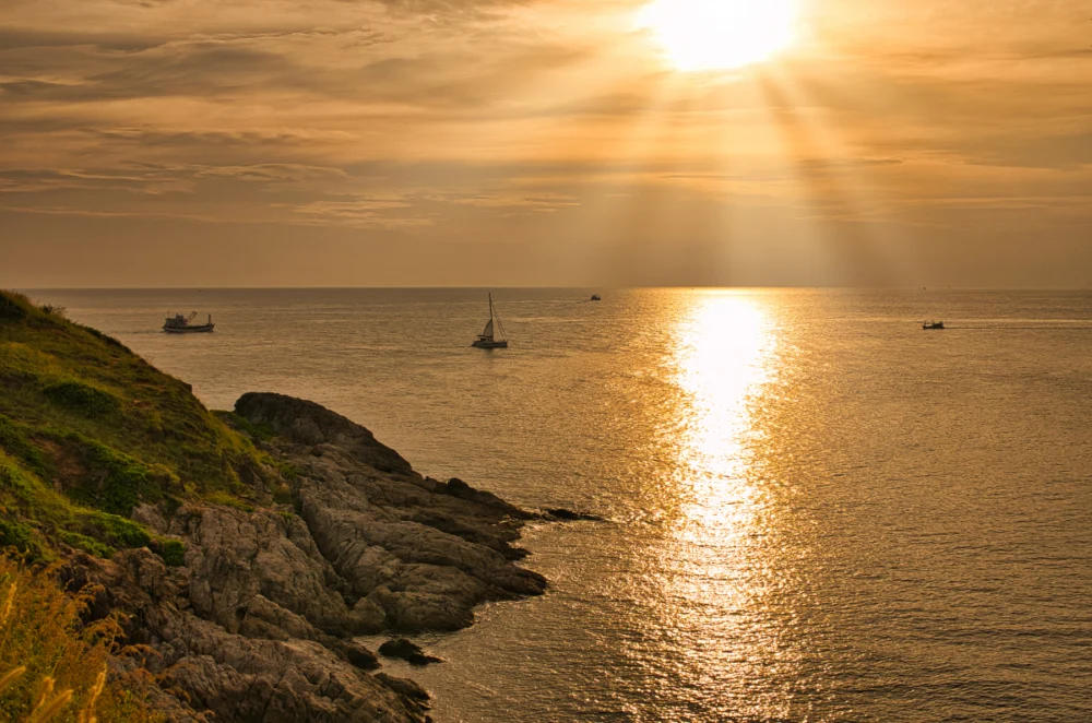 Promthep Cape sunset view in Phuket during calm evening sea conditions
