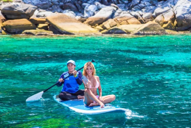 Paddleboarding in clear water at Racha Noi