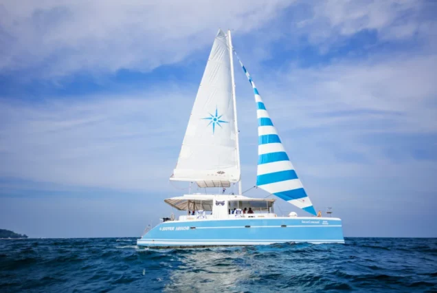 Side view of Silver Catamaran cruising on the sea near Phuket islands