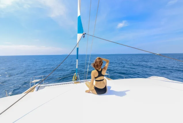 Guest sitting on the middle deck of Silver Catamaran