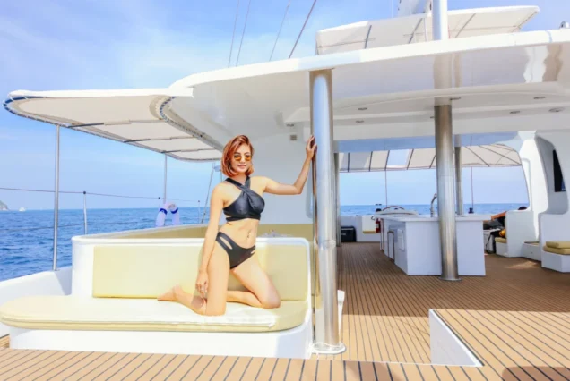 Guest posing on the sofa area of Silver Catamaran