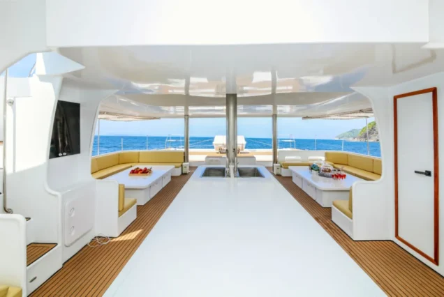 Silver Catamaran interior kitchen and table area