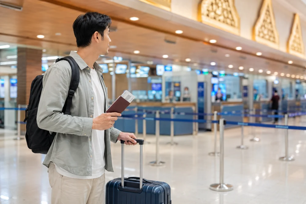 Traveller preparing to pass through airport immigration in Thailand
