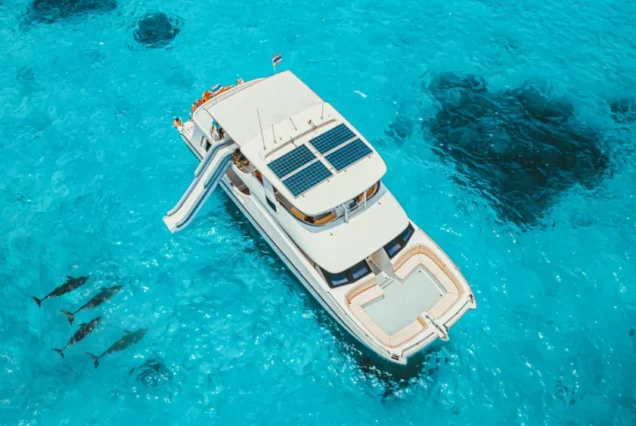 Moonlight Catamaran cruising through clear water near Maithon Island