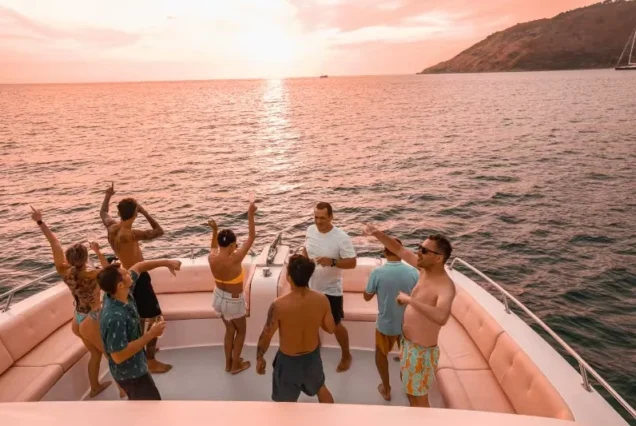 Guests enjoying the Moonlight Catamaran deck in the evening light