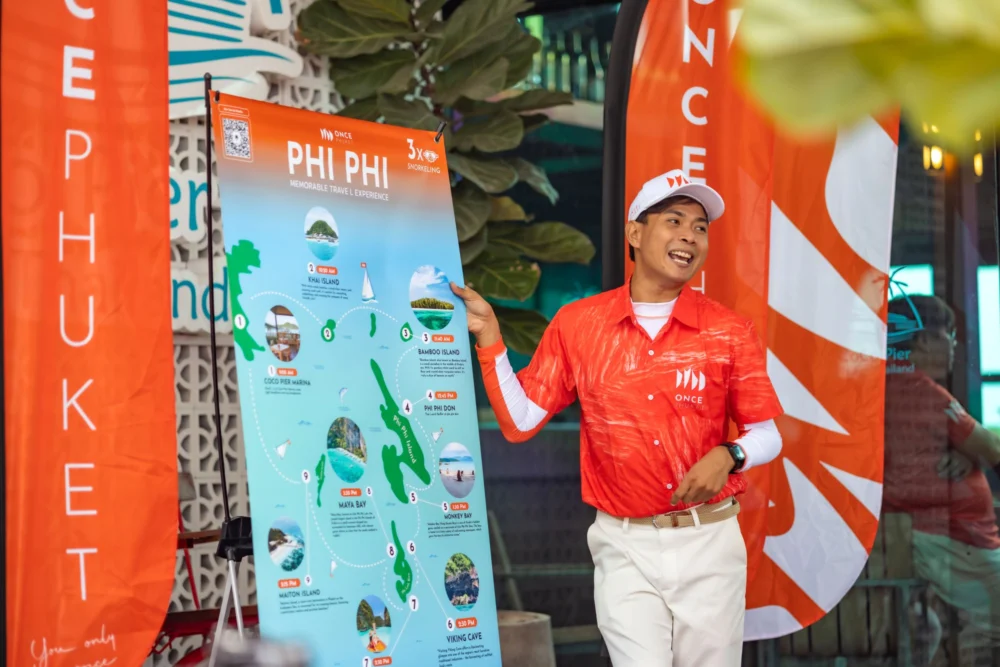 Phuket tour guide explaining the day trip to passengers at the pier