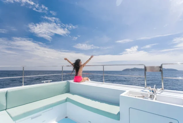 Guest relaxing on the yacht's bow sofa