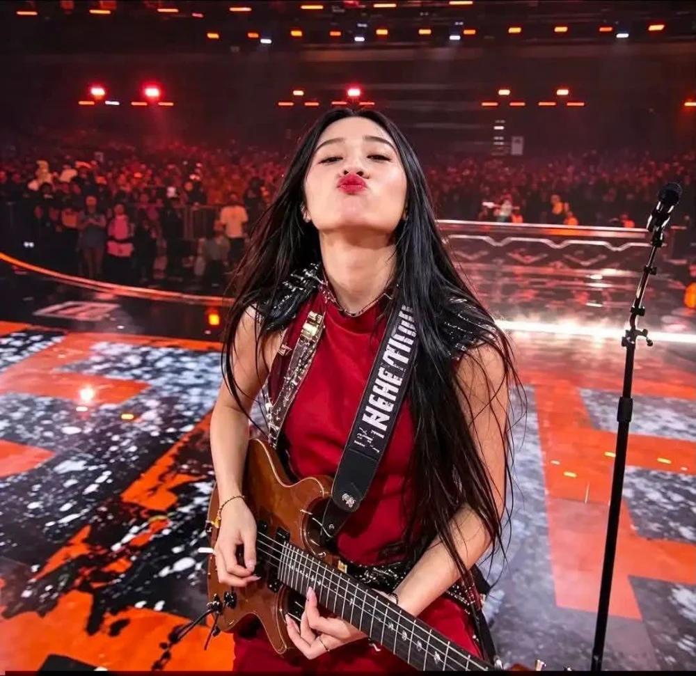 Nene Royal playing guitar during her Seven Nation Army AGT final performance