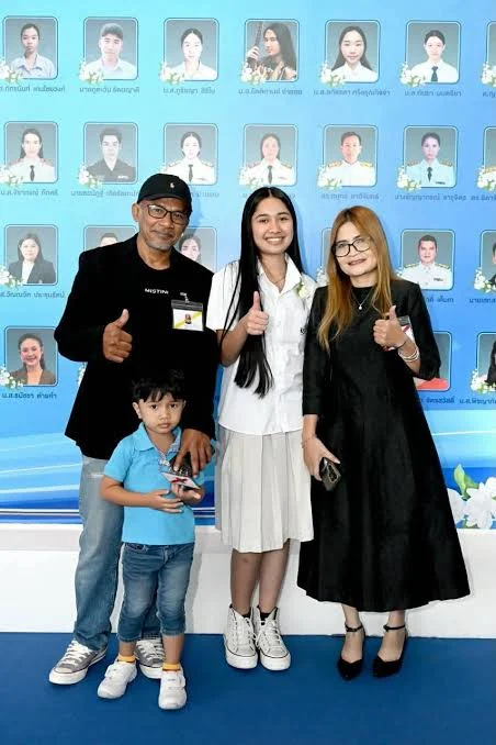 Nene Royal with family members in a family photograph