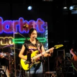 Nene Royal singing and playing her yellow guitar live at Naka Market Phuket