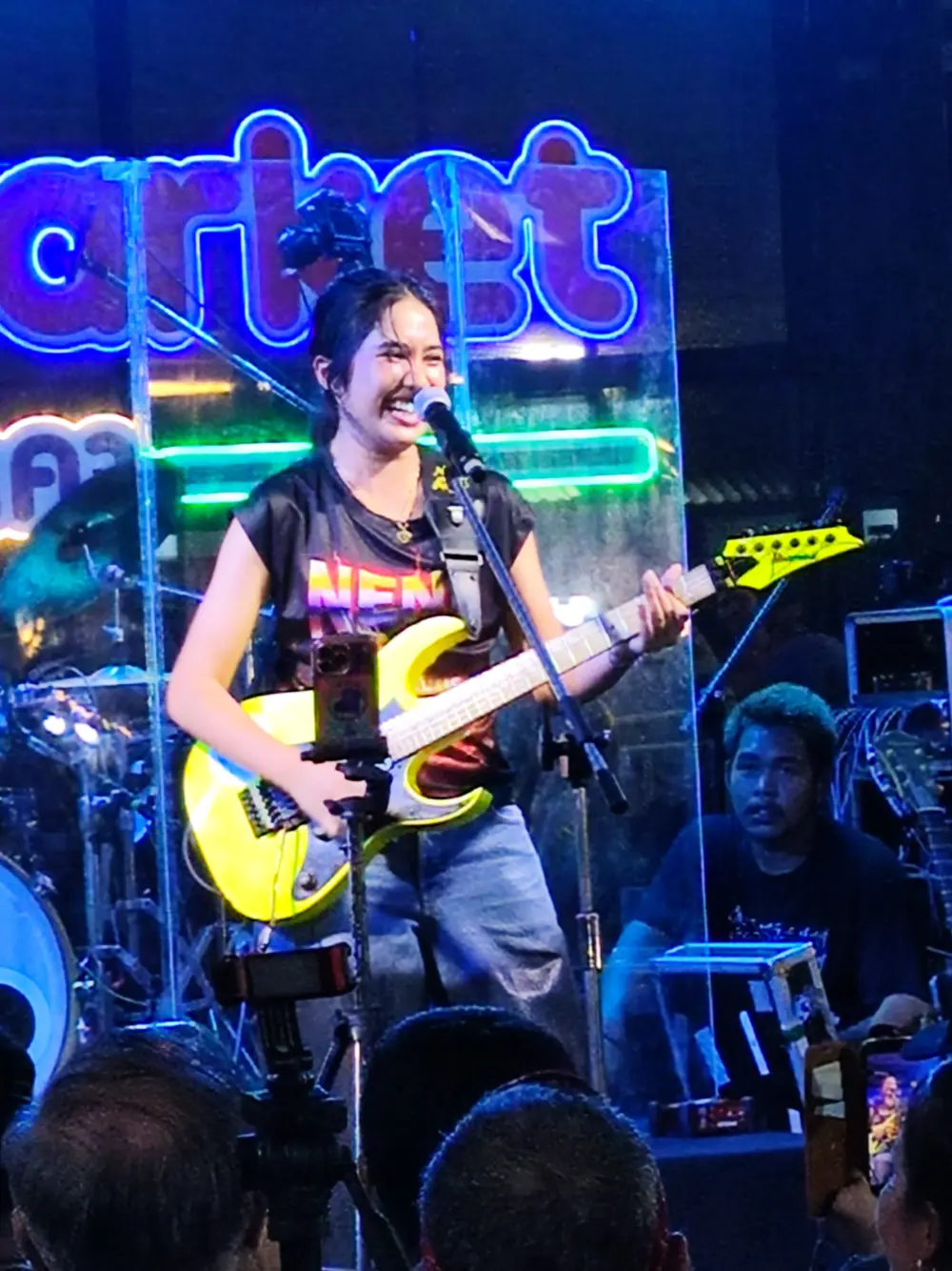 Nene Royal smiling during her live performance at Naka Market Phuket