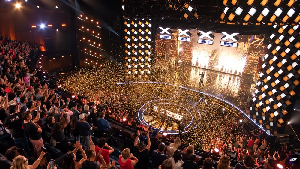 Golden confetti filling the AGT auditorium after Nene Royal’s win