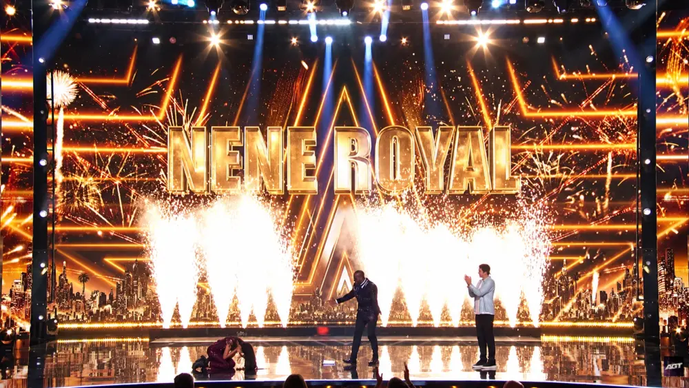 Nene Royal kneeling in an emotional moment as her AGT win is announced