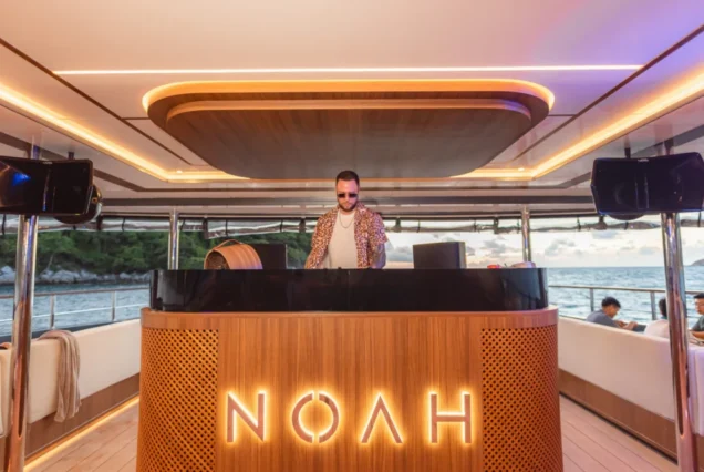 Resident DJ creating a refined beach-club atmosphere on Noah Yacht