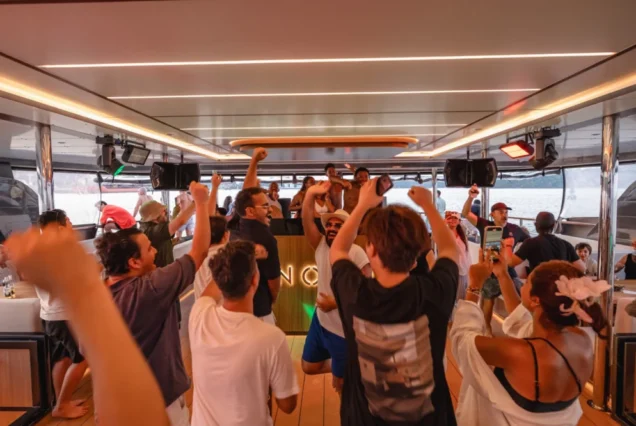 Guests celebrating with DJ music aboard Noah Yacht
