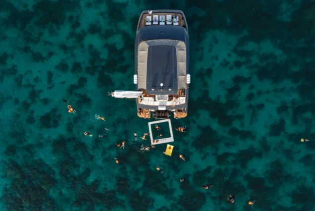 Aerial view of guests snorkelling beside Noah Yacht