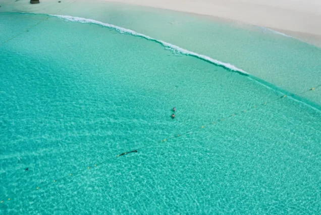 Clear turquoise water along Patok Beach at Racha Island