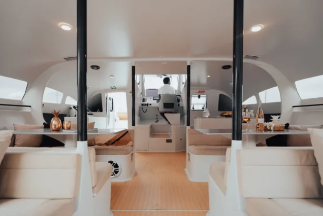 Minimalist sofa area inside Vibes Catamaran Yacht