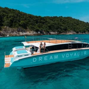 Dream Voyager turquoise catamaran yacht beside an island