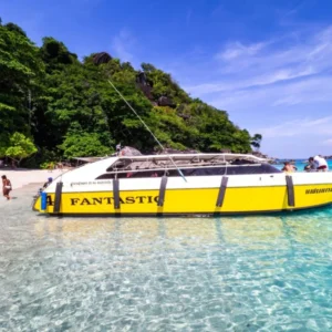 Fantastic yellow speedboat beside a Similan beach