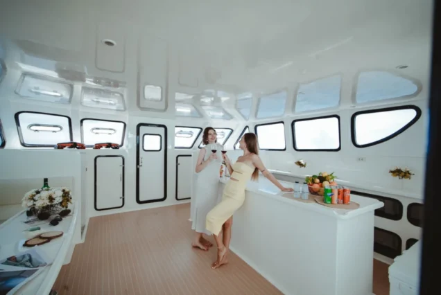 Guests beside the bar inside Flash No.7 yacht