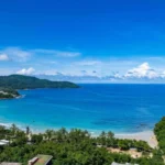 Kata Beach bay, the coastline and an offshore island viewed from above