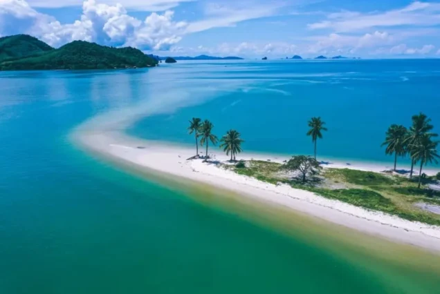 Palm-lined Laem Haad sandbar extending into turquoise water