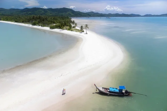 Laem Haad’s broad white sandbar and shallow coastal water