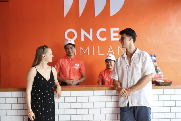 Staff assisting guests at the Once Lounge counter