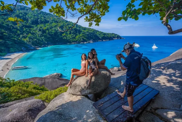 Visitors posing for a photo at a Similan viewpoint