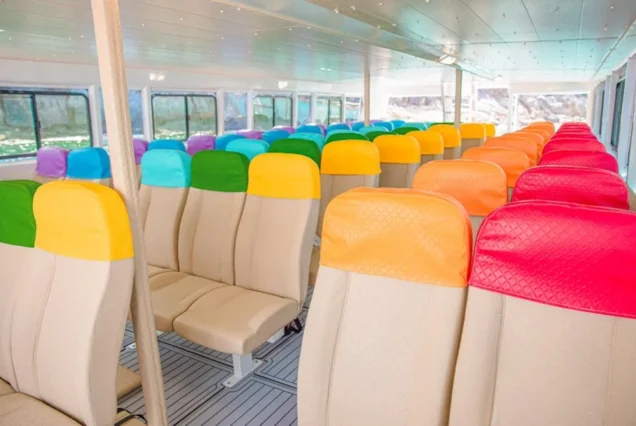 Colorful seats inside the Seastar Rainbow catamaran cabin